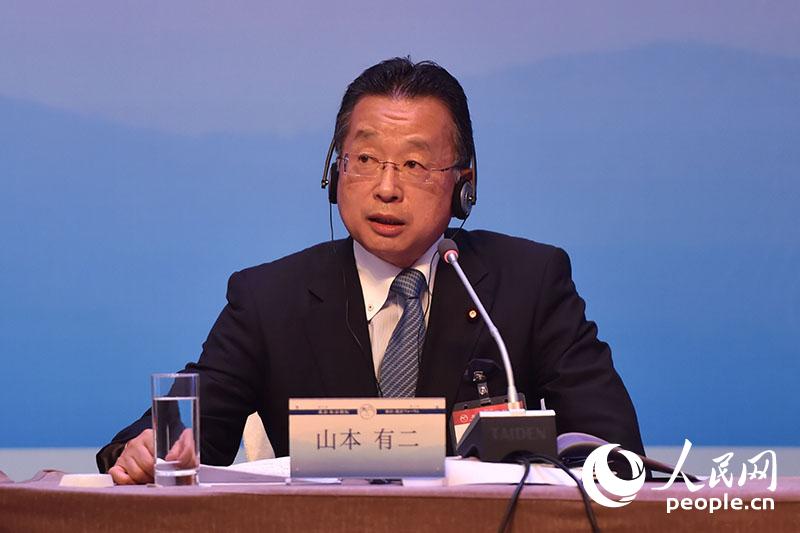 前日本金融擔當大臣山本有二。 翁奇羽攝